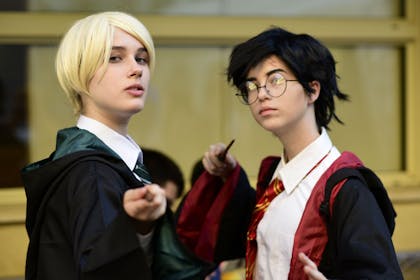 Two kids dressed as Malfoy and Harry Potter
