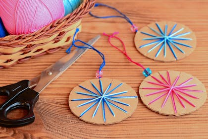Cardboard bauble shapes with colourful thread