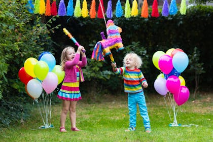 Kids with Easter egg piñata