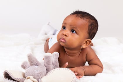 Baby girl with elephant teddy 