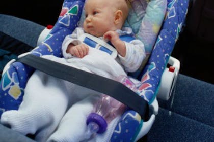 baby sitting in car seat