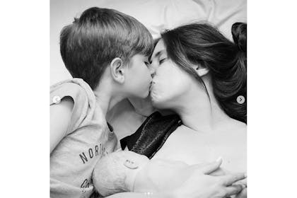 Stacey Solomon kissing her son after the birth of her new son