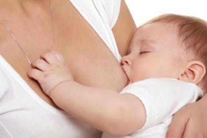 A mother breastfeeding a baby