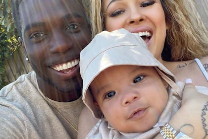 Marcel Somerville and Rebecca Vieira with their son