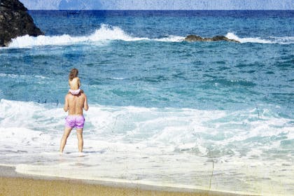 Parent and child at beach