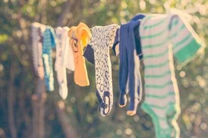 Babygrows drying on washing line outside