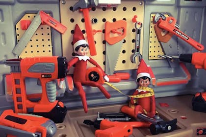 Two Elves on the Shelf doing some DIY