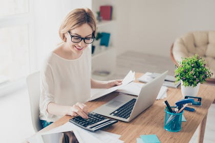 Woman working on calculator