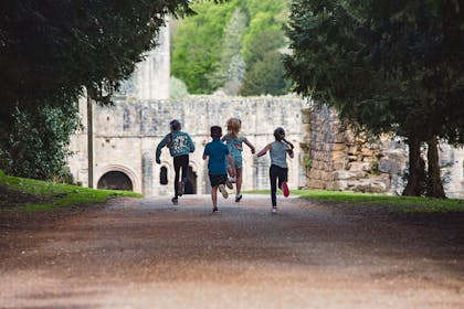 Kids running at Fountains Abbey