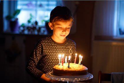 8-year-old boy with birthday cake