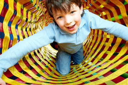 child at adventure playground