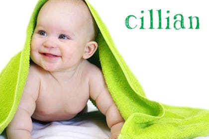 child under green towel