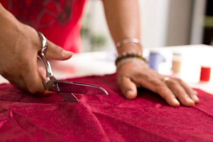 Picture of a woman cutting material