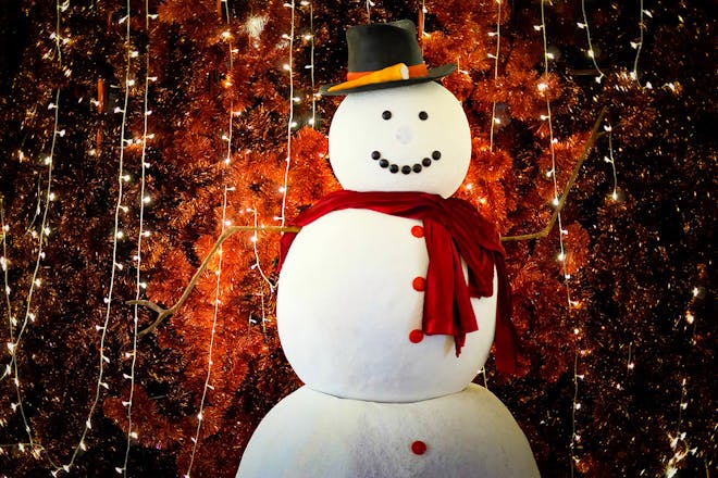 fake snowman with fairy lights