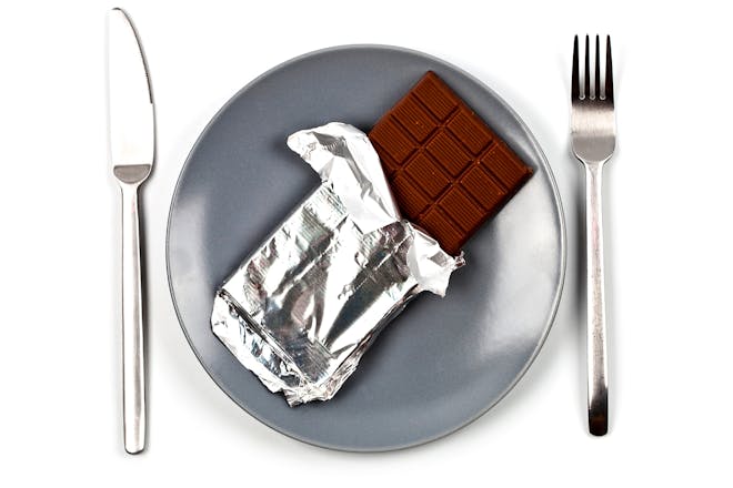 Chocolate on a plate with knife and fork