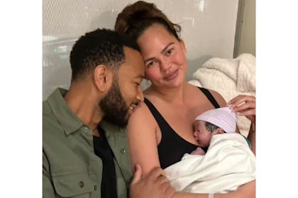 Chrissy Teigen and John Legend with newborn