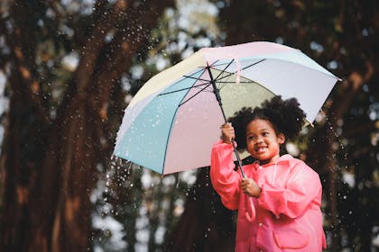 smiling girl with brolly