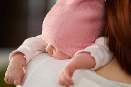 new baby over mum's shoulder