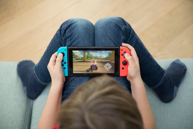 Child playing Nintendo Switch