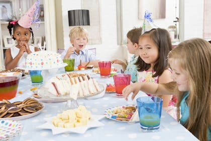 children eating a birthday party tea