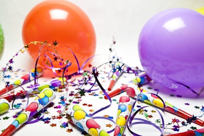 Party horns, balloons and confetti
