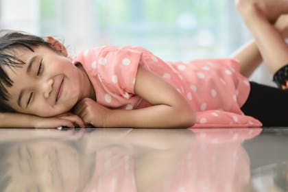 child lying on floor