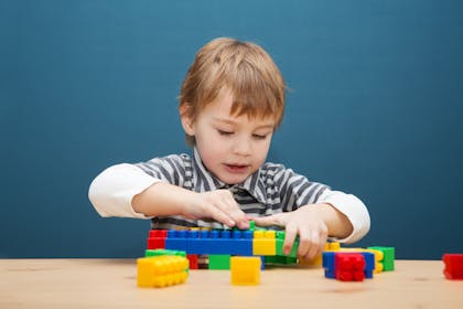 child playing with lego