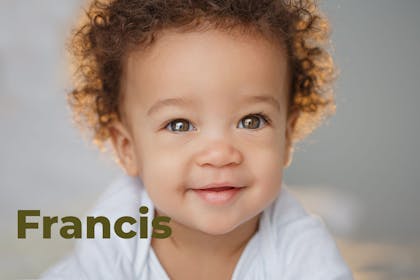Baby with curly hair. Name Francis written in text