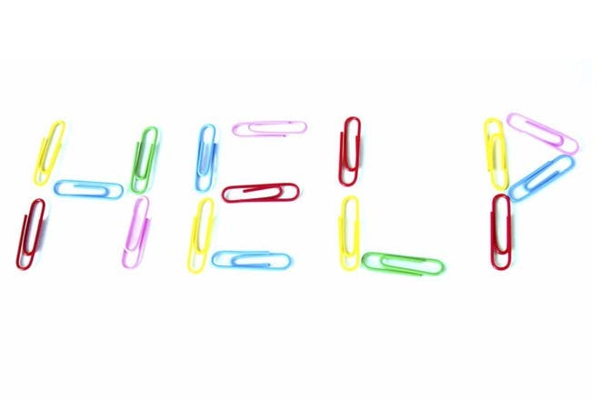 colourful paper clips spelling the word help