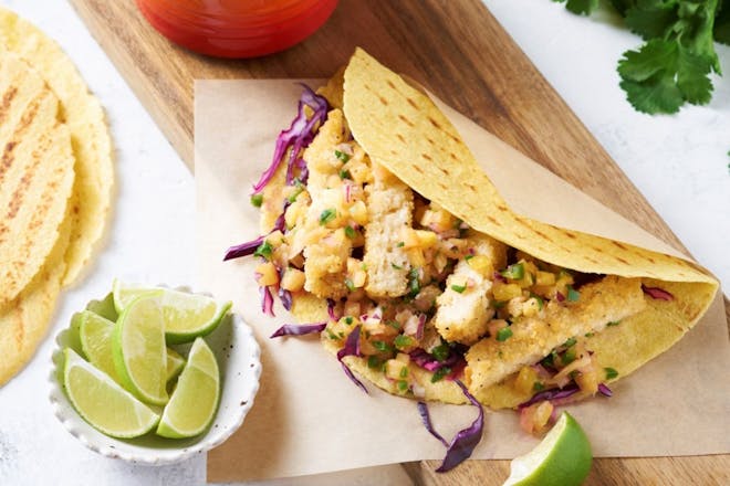 Breaded vegan fish fillets in tacos with pineapple salsa