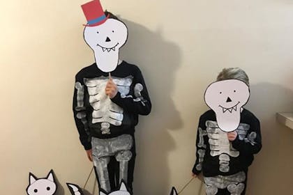 Two little boys dressed as skeletons