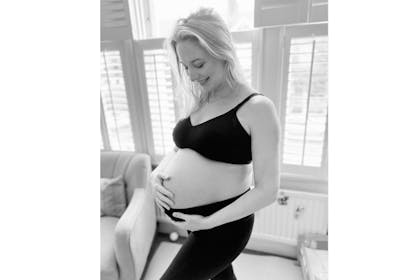 Ali in black and white photo holding bump