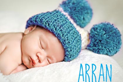 baby with hat on sleeping
