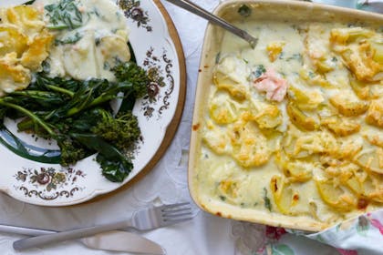 fish pie in a dish with vegetables
