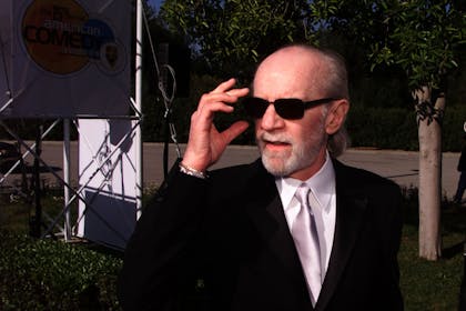 George Carlin wearing sunglasses