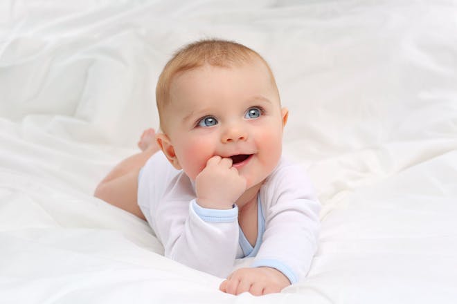 baby with fingers in mouth