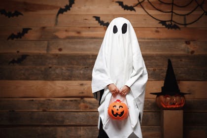 A kid dressed as a ghost