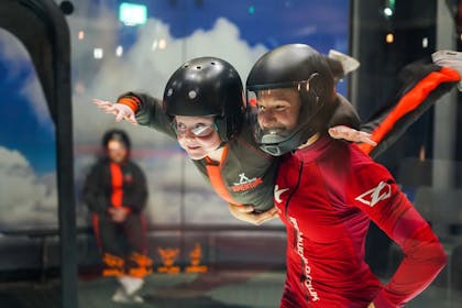 A girl enjoys an indoor skydiving adventure at The Bear Grylls Adventure in Birmingham