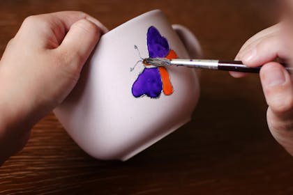 Mug painting with butterfly design