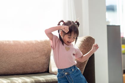 Girl dancing in living room
