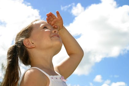 Girl looking at clouds