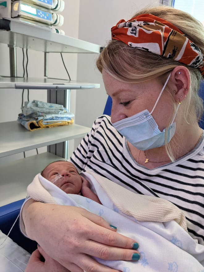Charlie with premature son in NICU