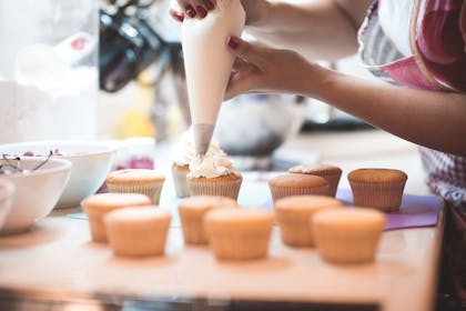 Woman baking cupcakes