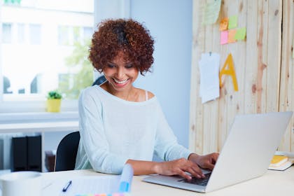 Woman typing on laptop