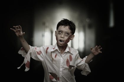 Young boy in a zombie Halloween costume