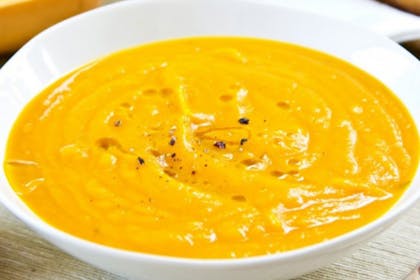 butternut squash soup in white bowl