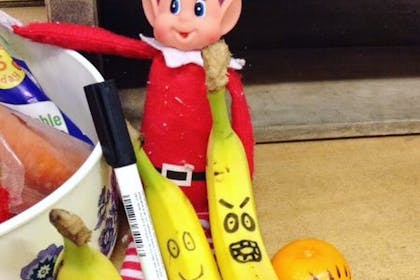 Elf on the Shelf drawing on fruit