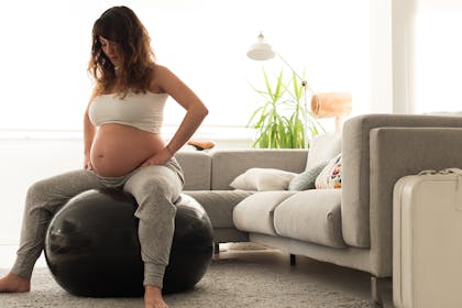 Pregnant woman on birthing ball