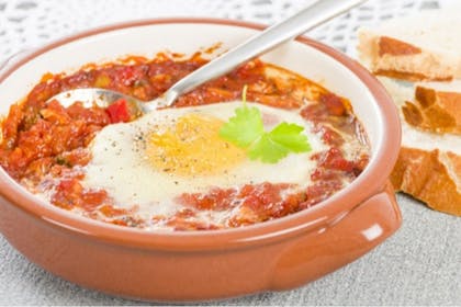 Cheesy eggs and tomatoes