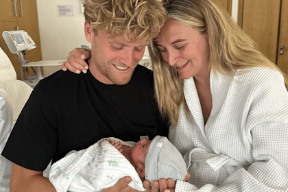Tiffany Watson and husband cradle newborn baby in hospital